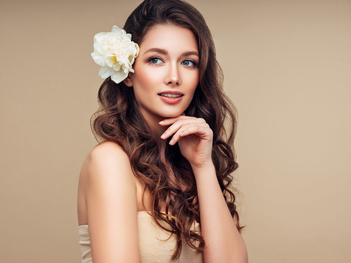 Beautiful woman with a flower in her hair