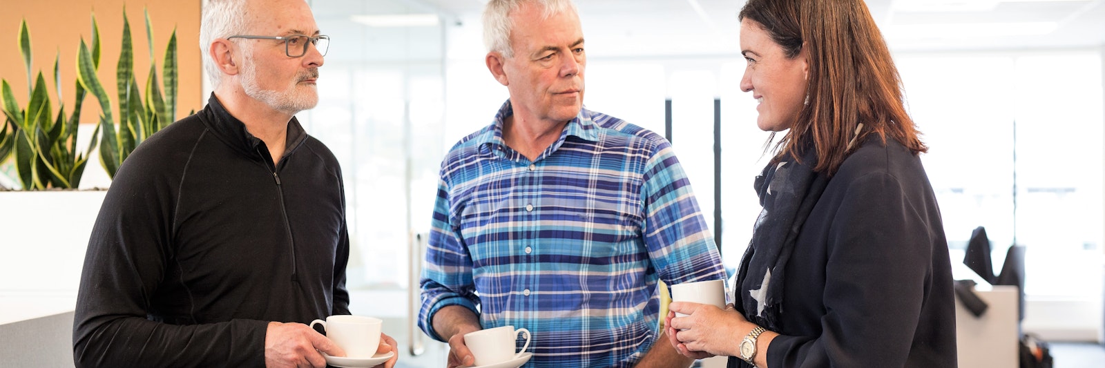 three people in conversation