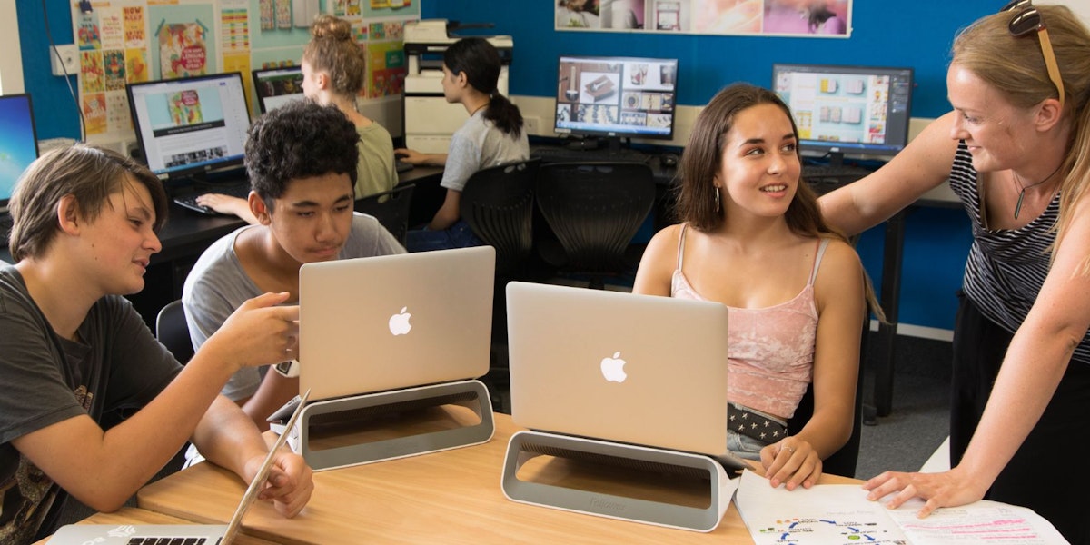 students with laptops