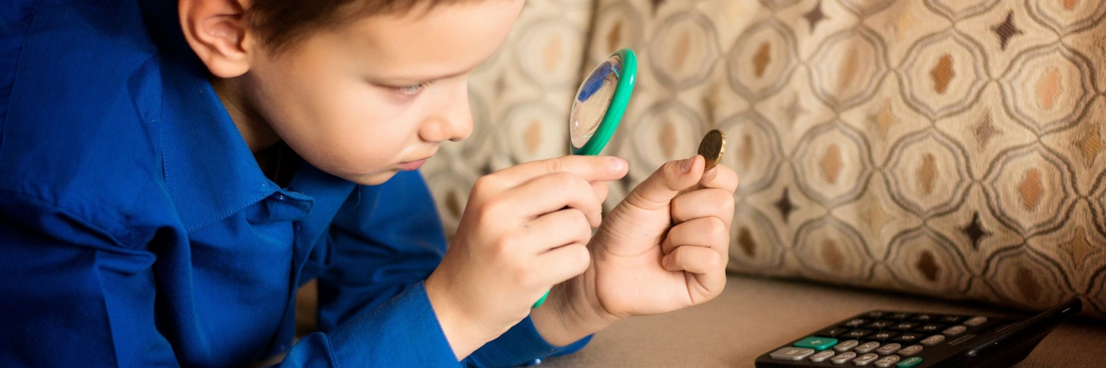 Student using magnifying glass