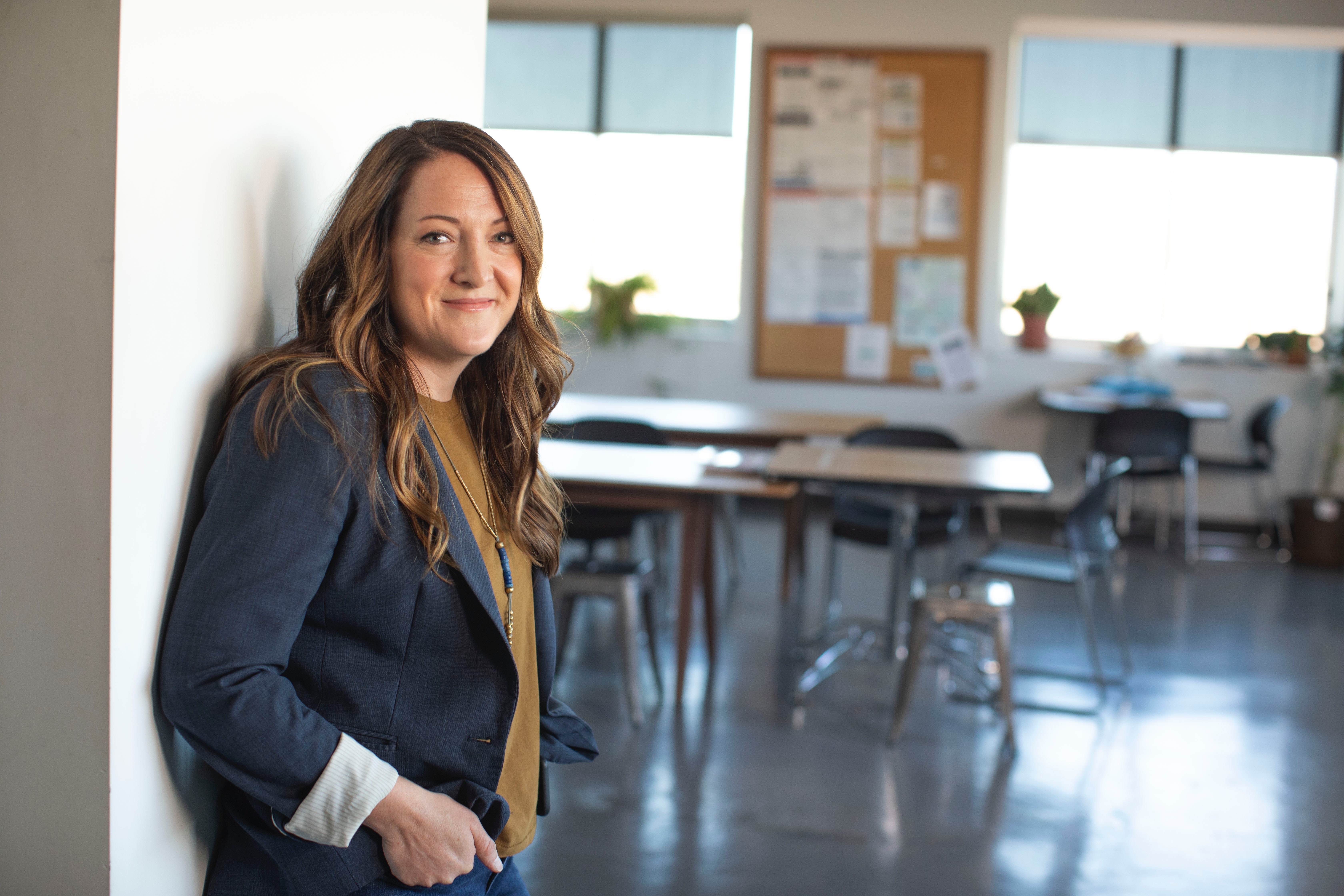 Teacher inside empty classroom