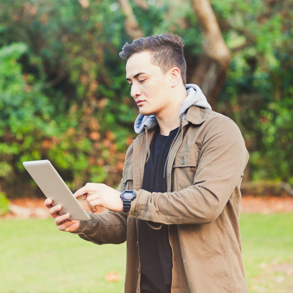 Man looking at a tablet