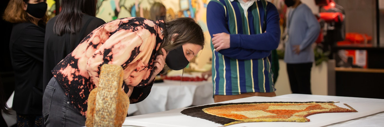 Teacher looking an an artefact in a museum