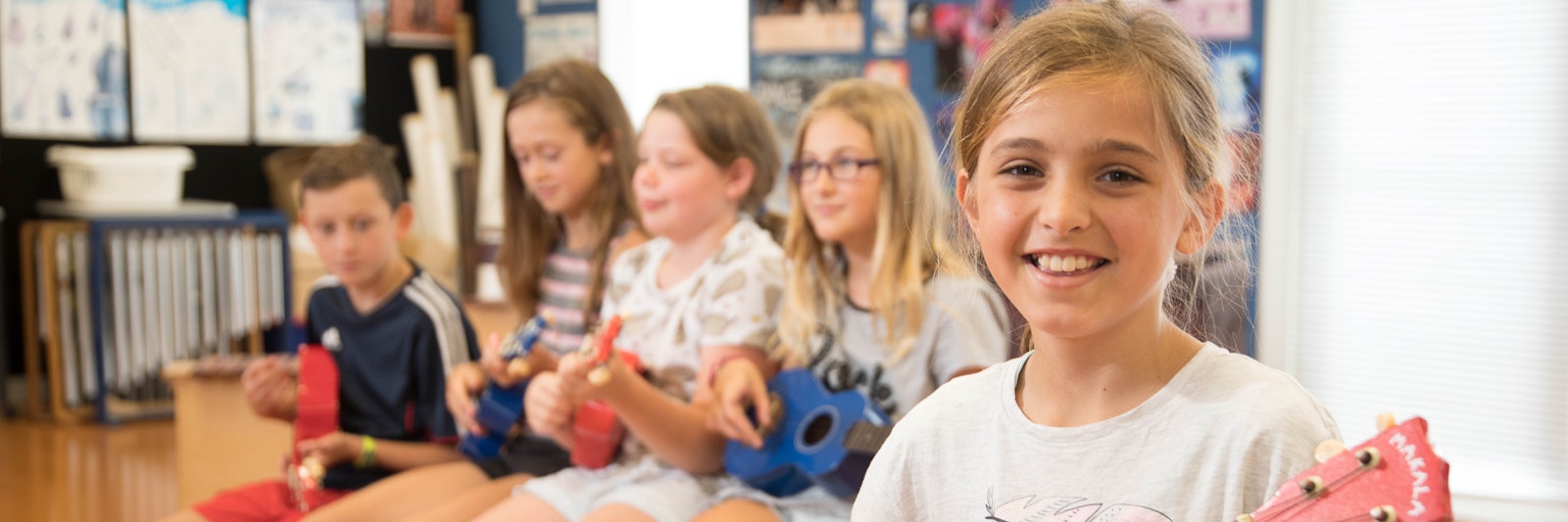 Girl playing the ukulele