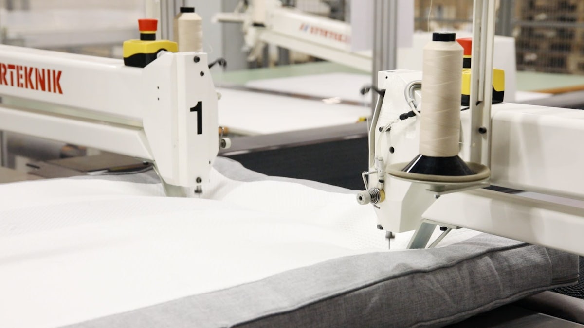 Sewing machine robot at Beds by Scapa.