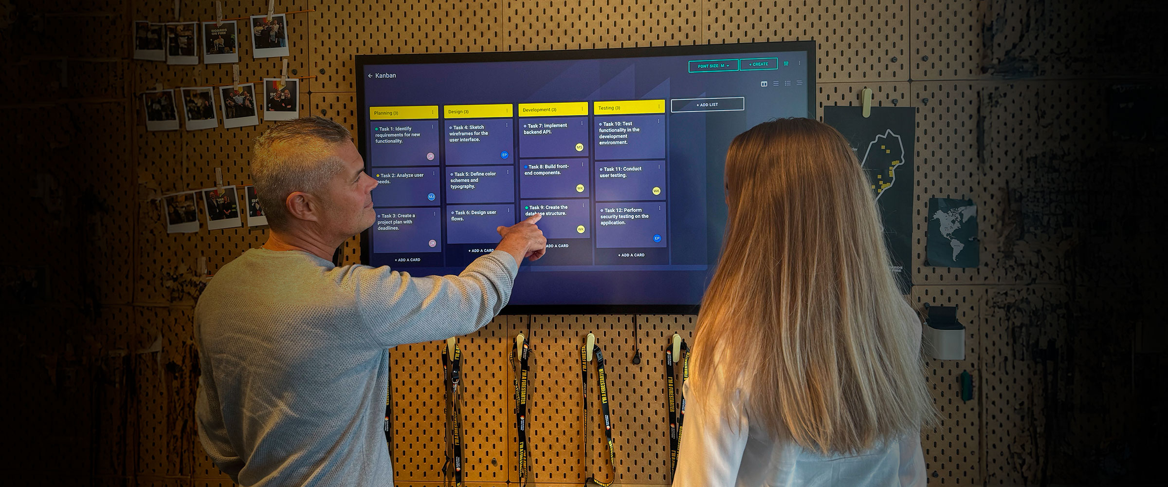 Two people having a meeting in Boards on Fire’s Kanban board