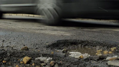 Google wil waarschuwen voor gaten in de weg