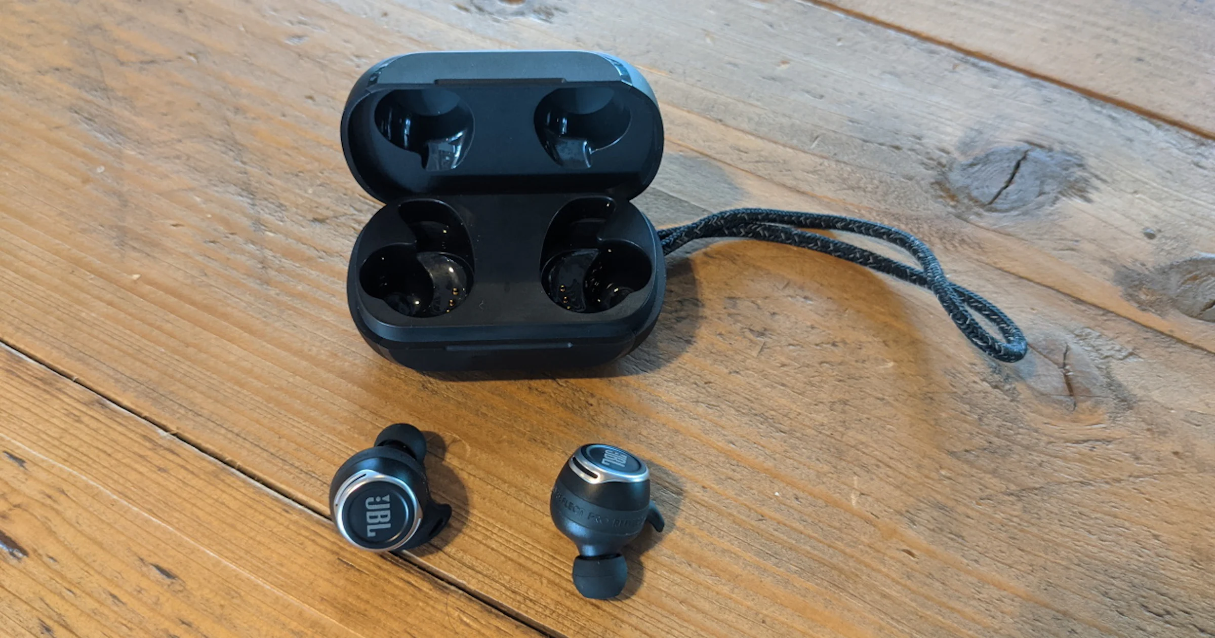 JBL Reflect Flow Pro - Gevleugelde oortjes