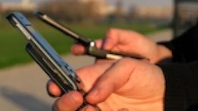 'Gezamenlijk ophogen mobiele tarieven is toeval'