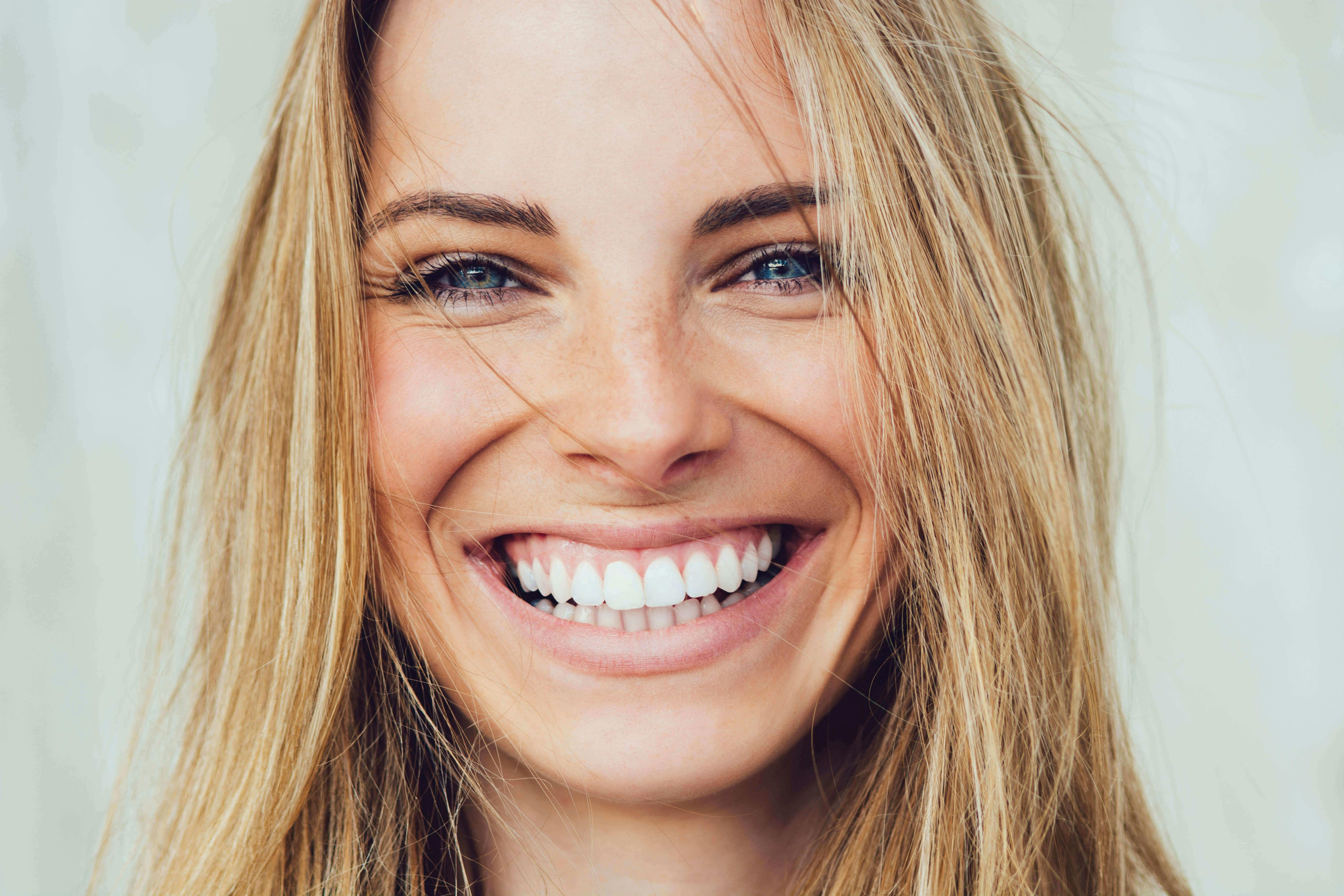Close-up of blonde woman smiling
