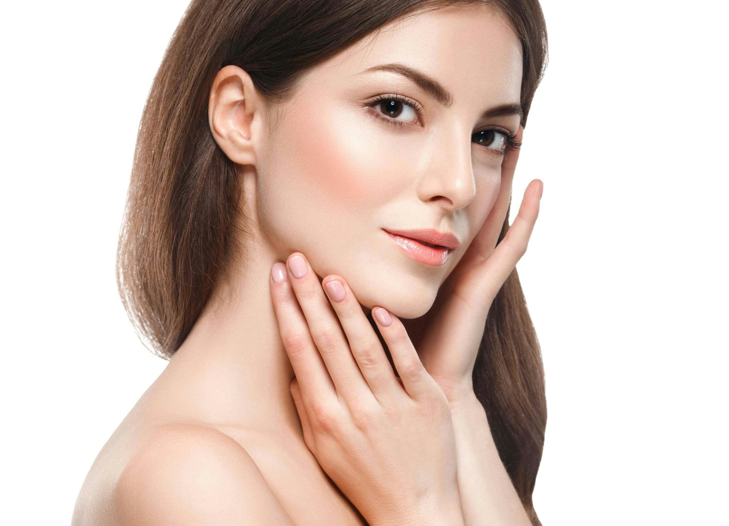 Brown-haired woman holding hands to her face