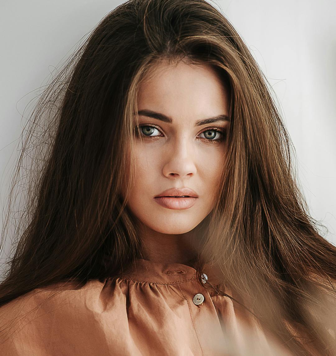 woman with brown hair and green eyes