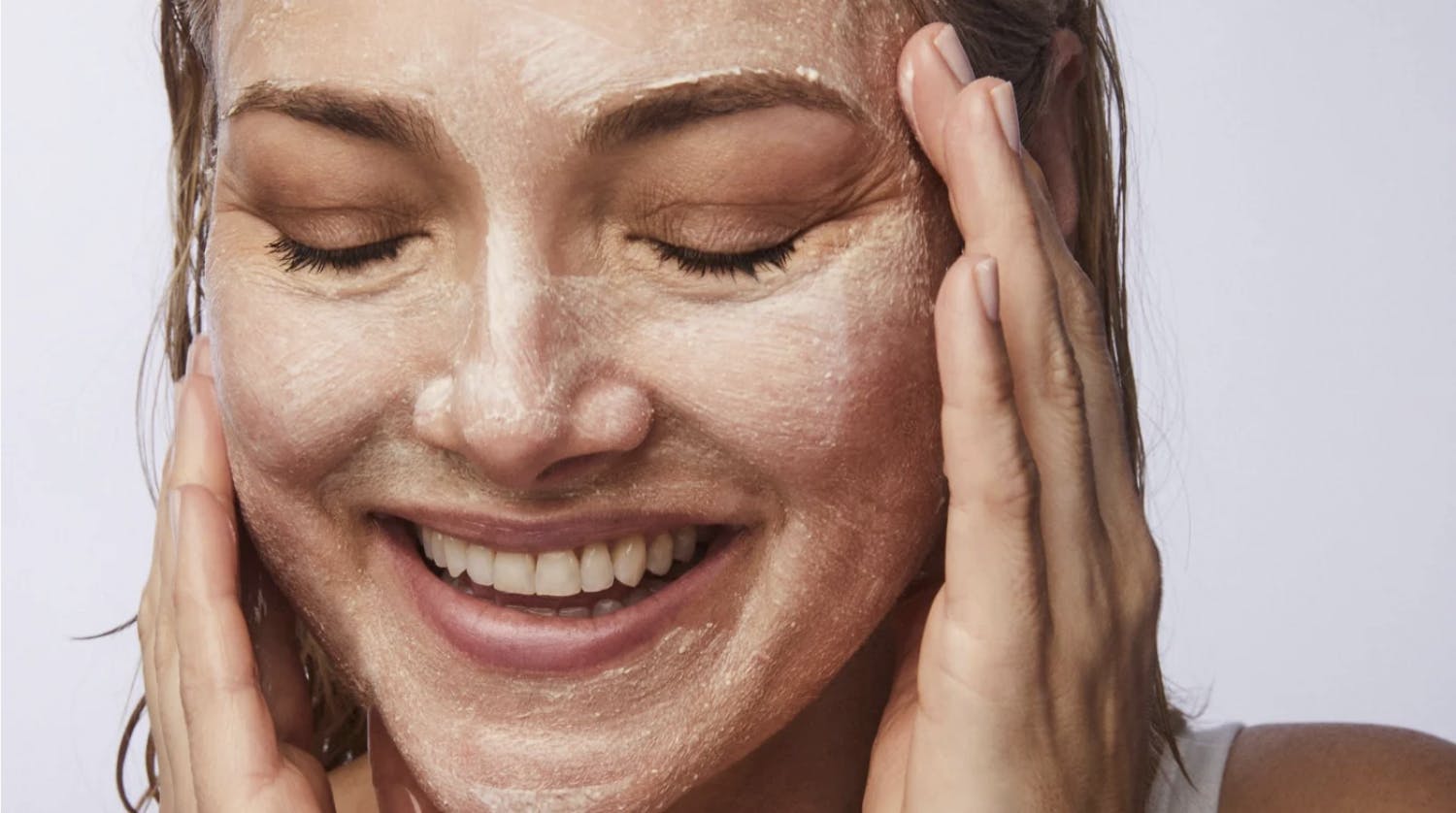 woman applying KaramMD polish to face
