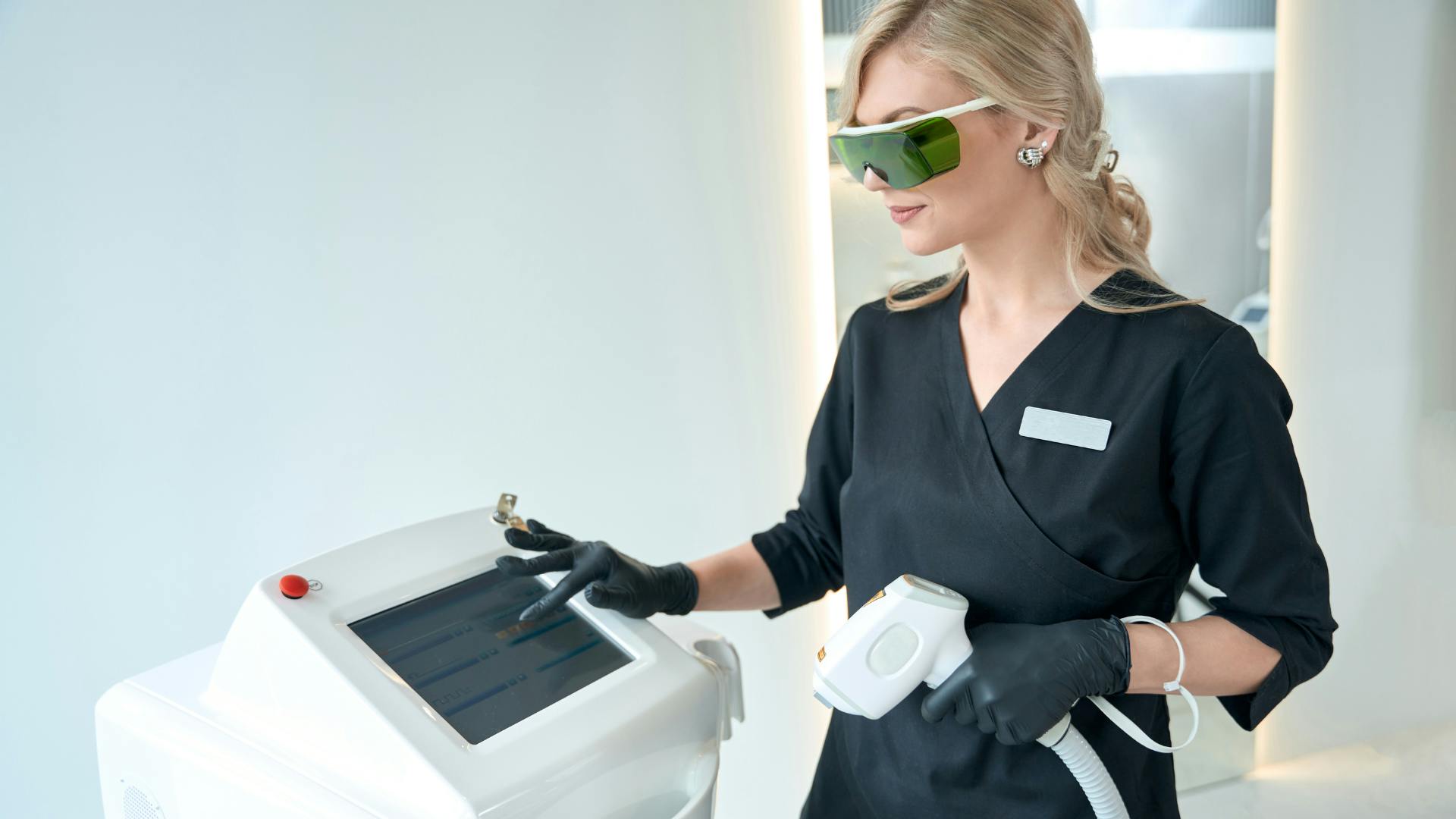 women operating laser device