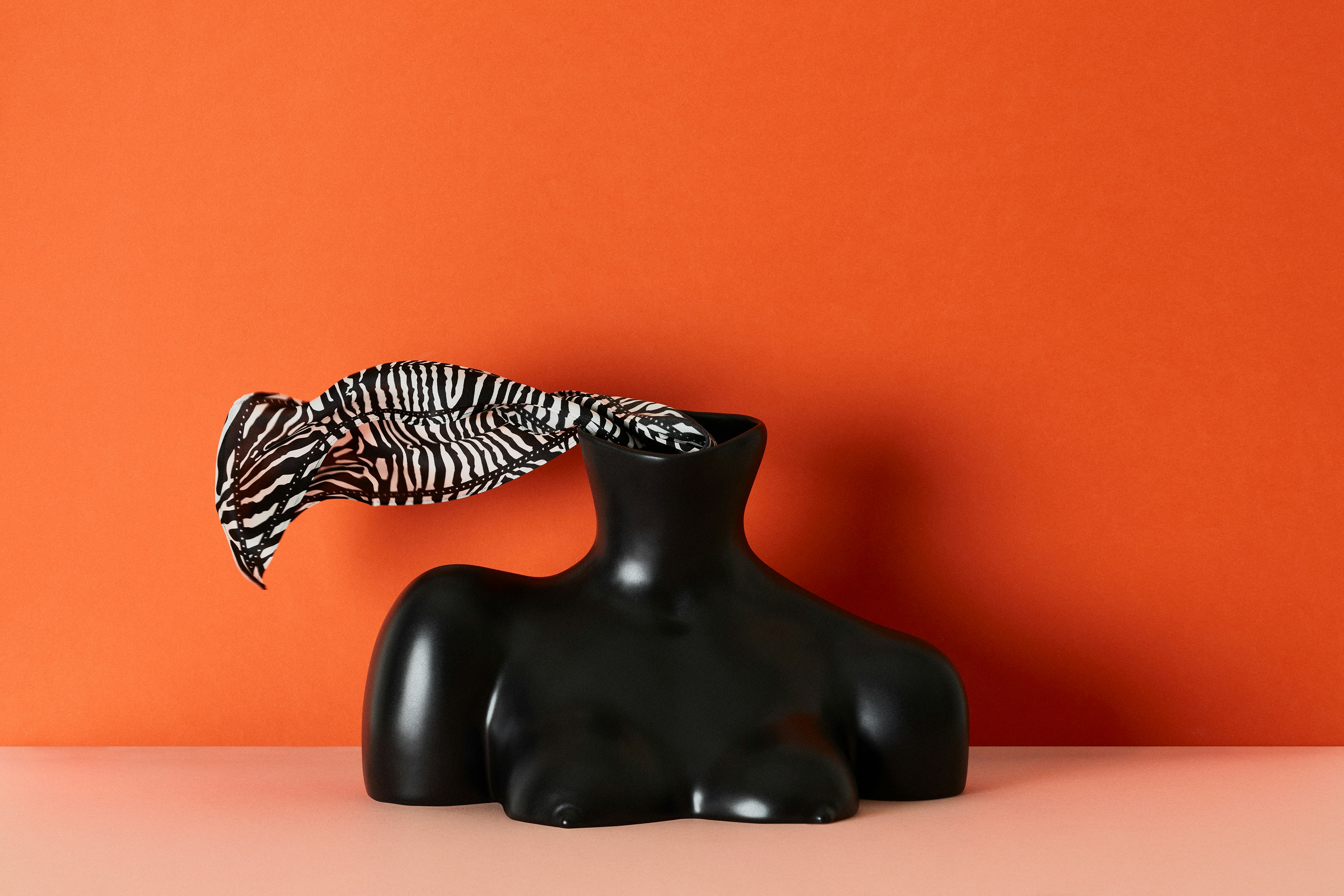 Zebra print silk scarf layered over a body sculpture 