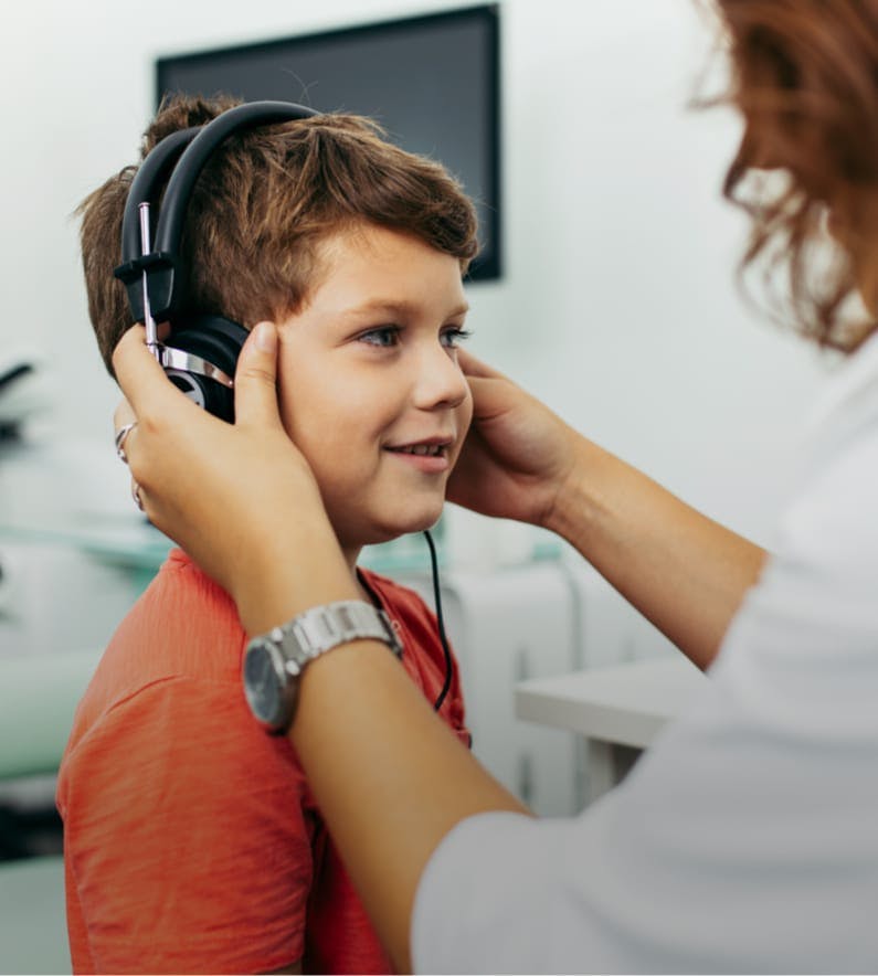 Young boy wearing headphones