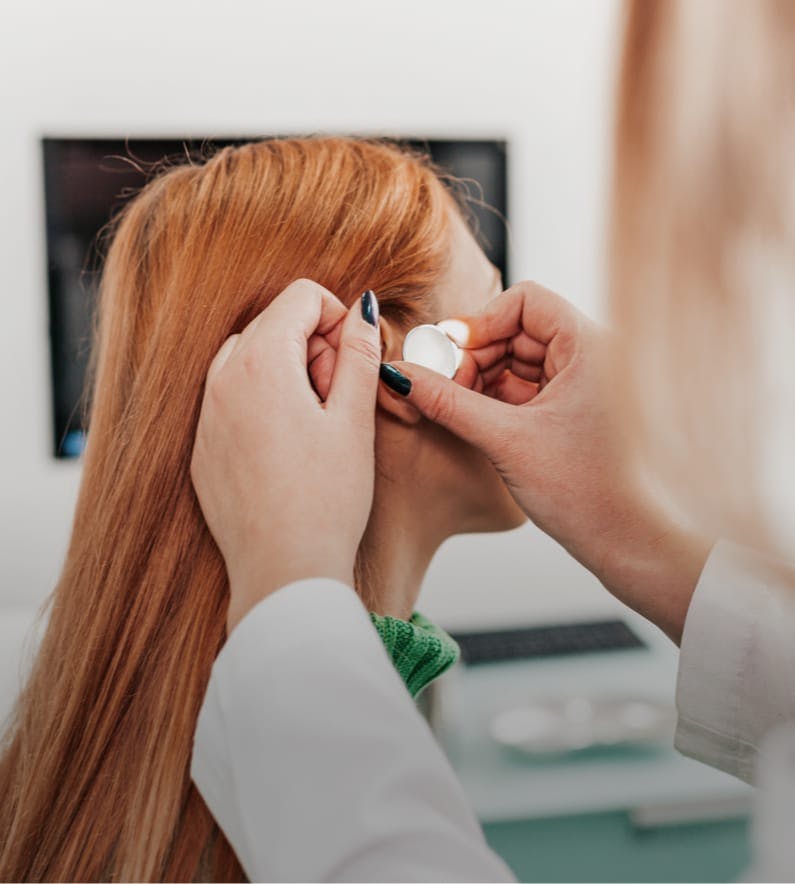 Girl getting hearing aids