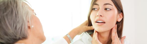 Doctor checking on a patient