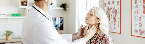 Doctor checking on a patient