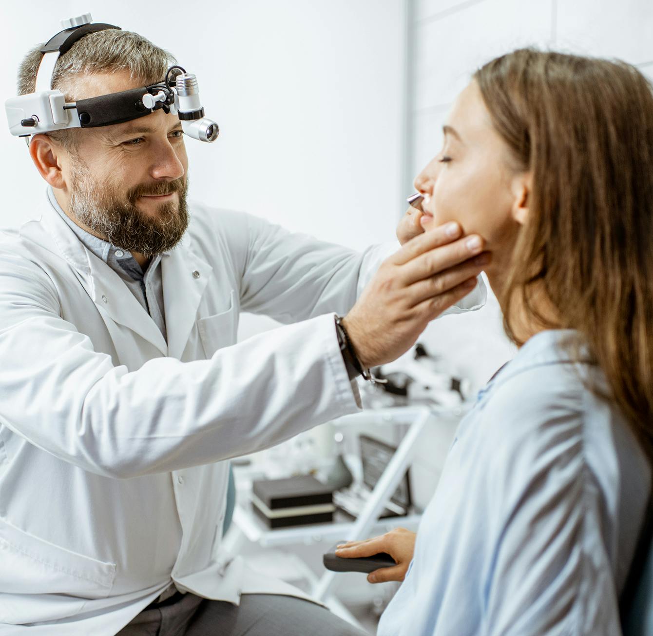 Doctor checking on a patient
