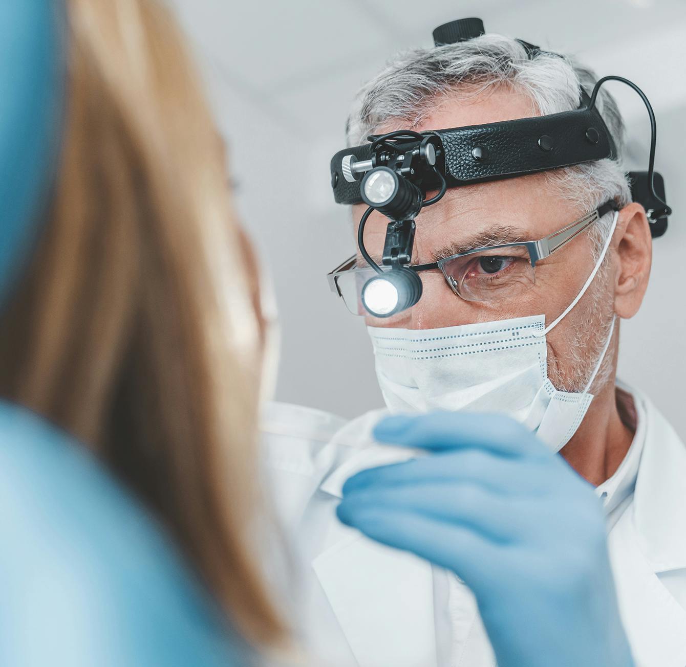 Doctor checking on a patient