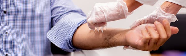 Doctor checking on a patient