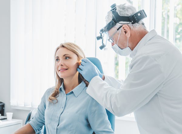 Doctor checking on a patient