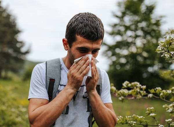 Man blowing his nose