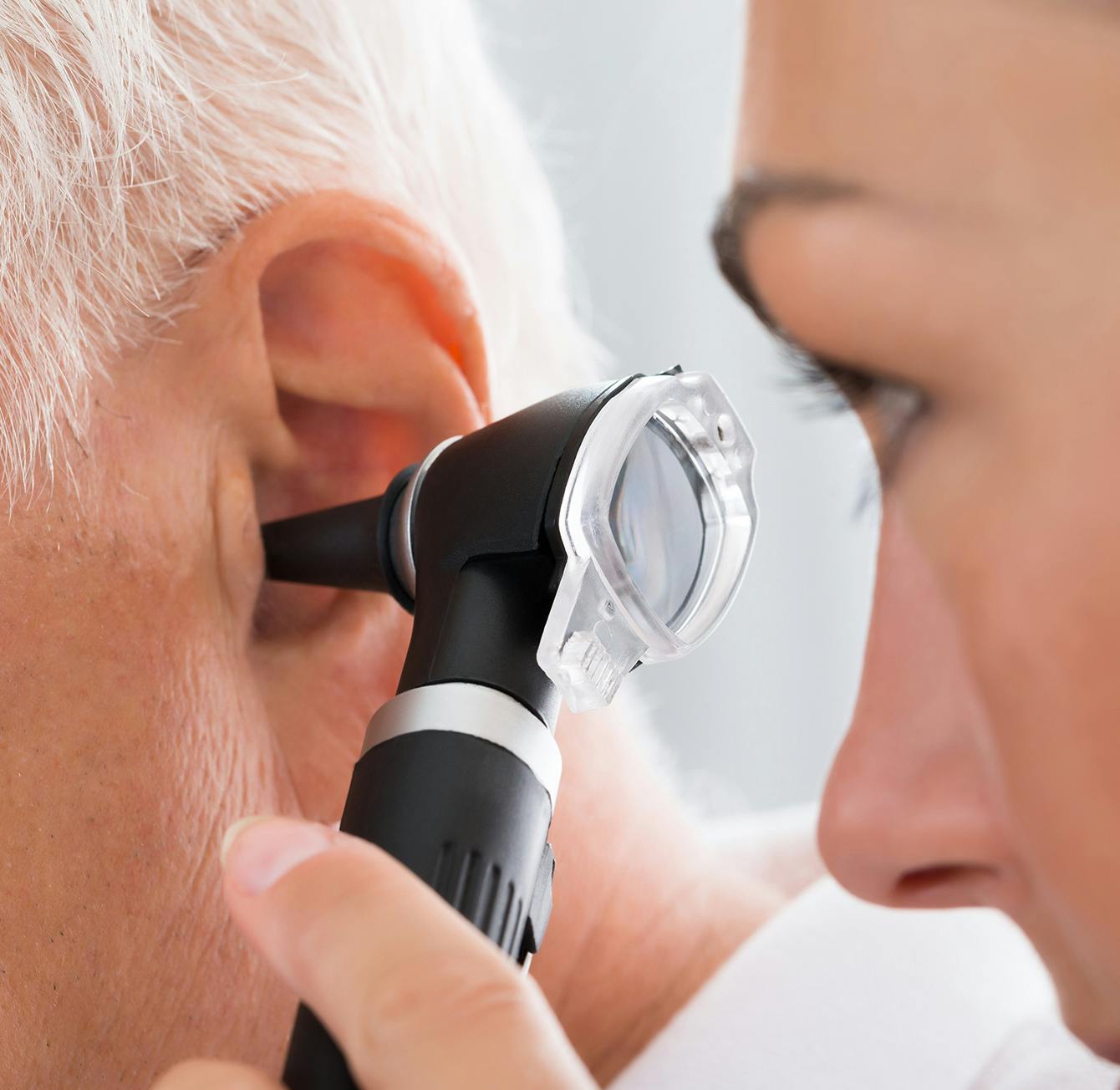 Man having his ear examined