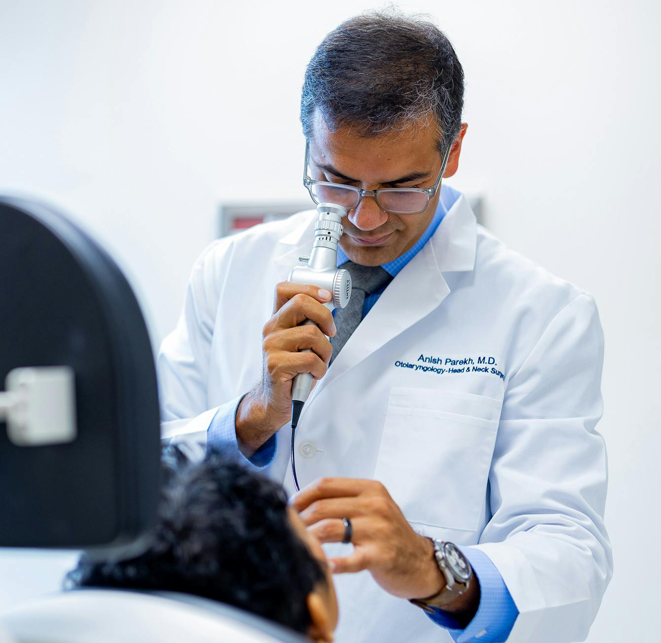 Doctor examining a patient in a chair