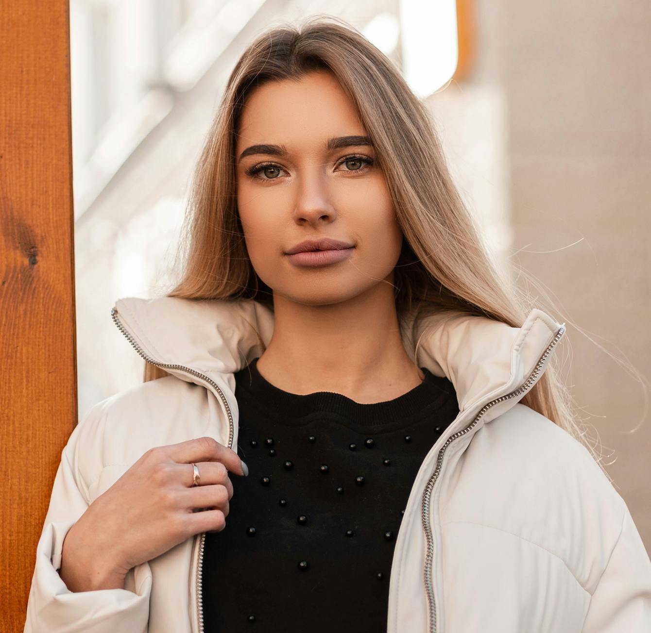 Woman in a tan coat