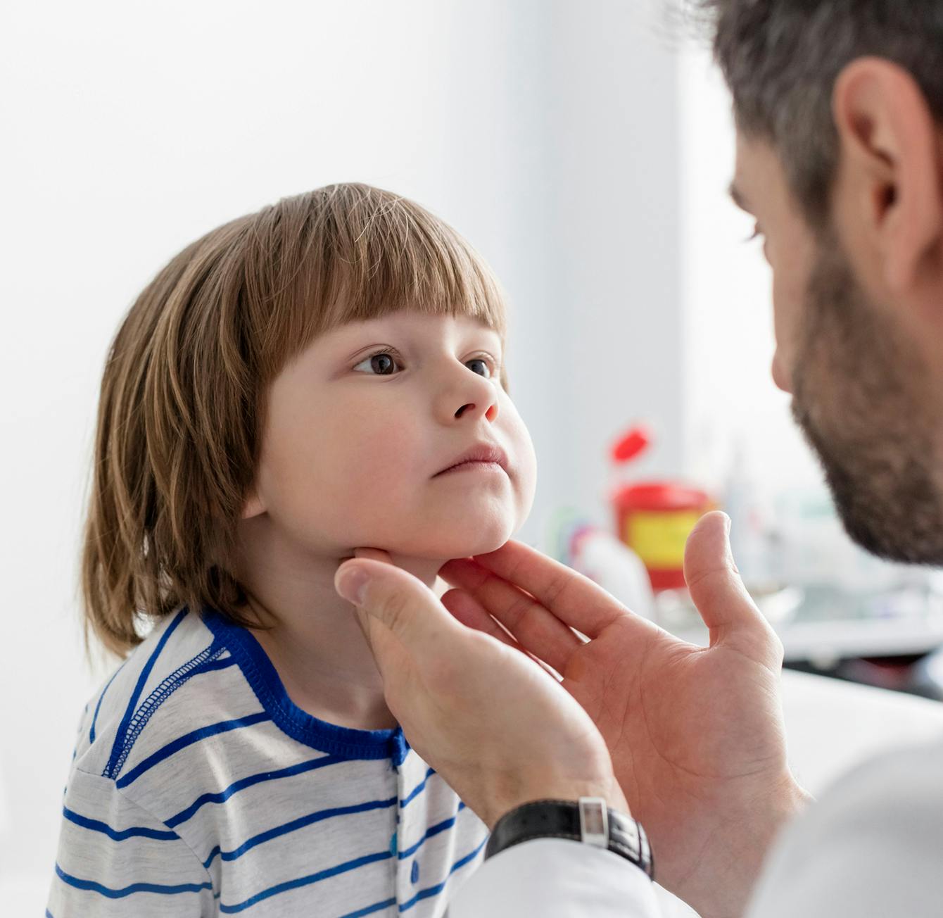 Doctor checking on a patient
