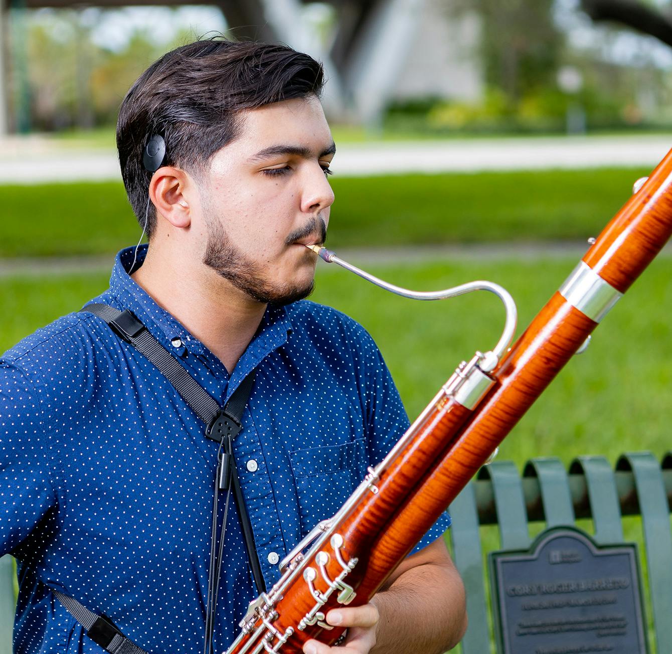 Man with hearing implant playing the bassoon