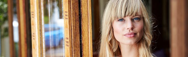 Woman standing in a doorway