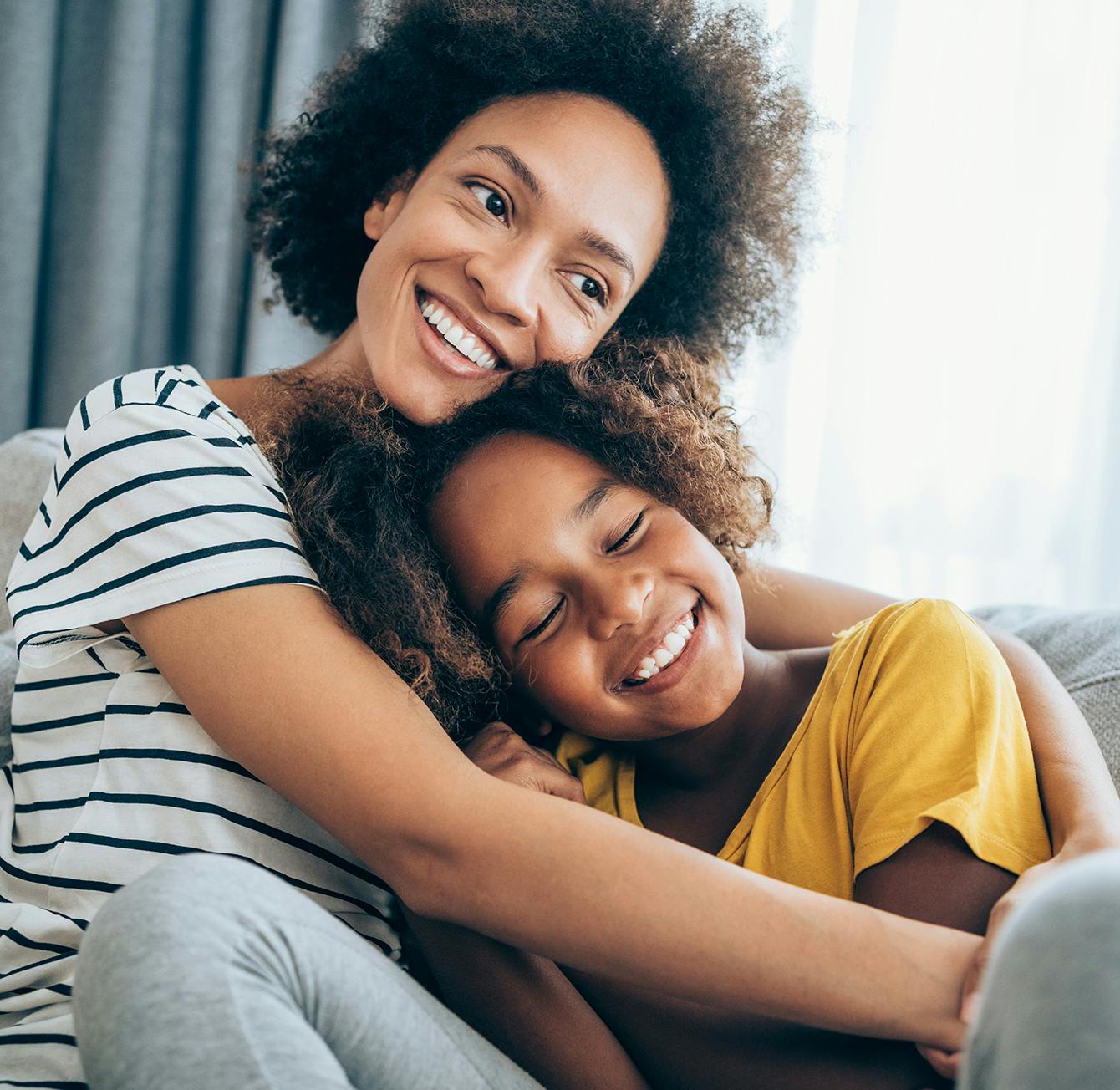 Mother and daughter hugging