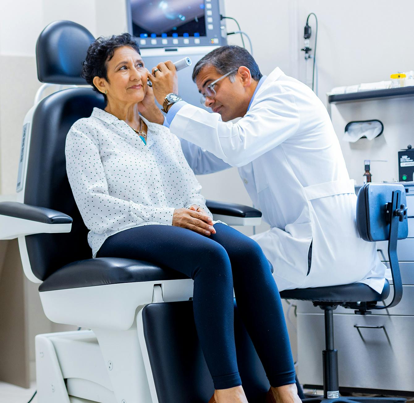 Doctor checking on a patient