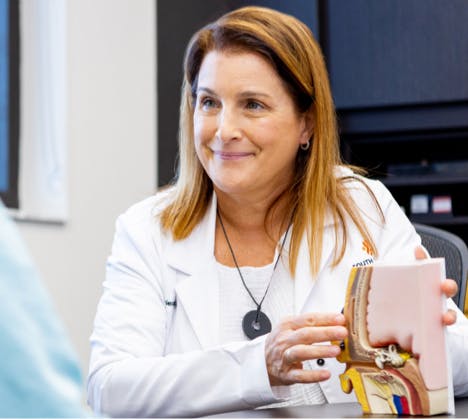 Female physician holding 3D medical model