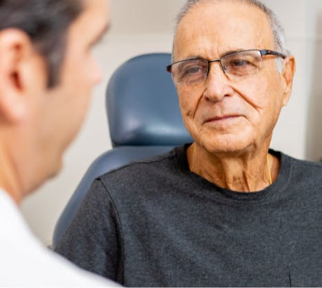 Male patient listening to physician