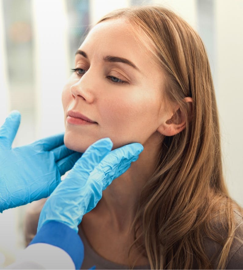 Woman getting her Head and Neck Looked at by Doctor