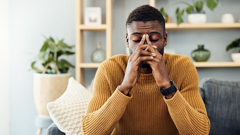 Woman with her hands on her face