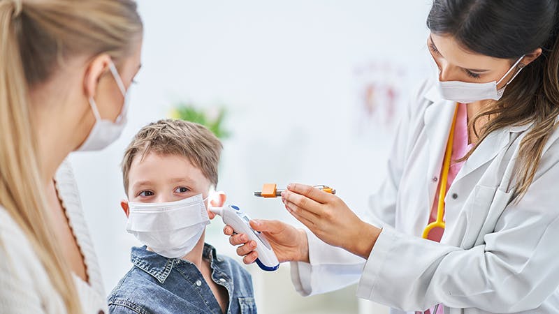 Doctor checking on a patient