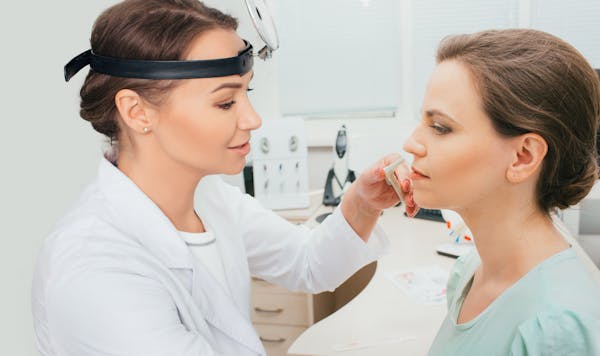 Doctor consulting a patient about sinuses