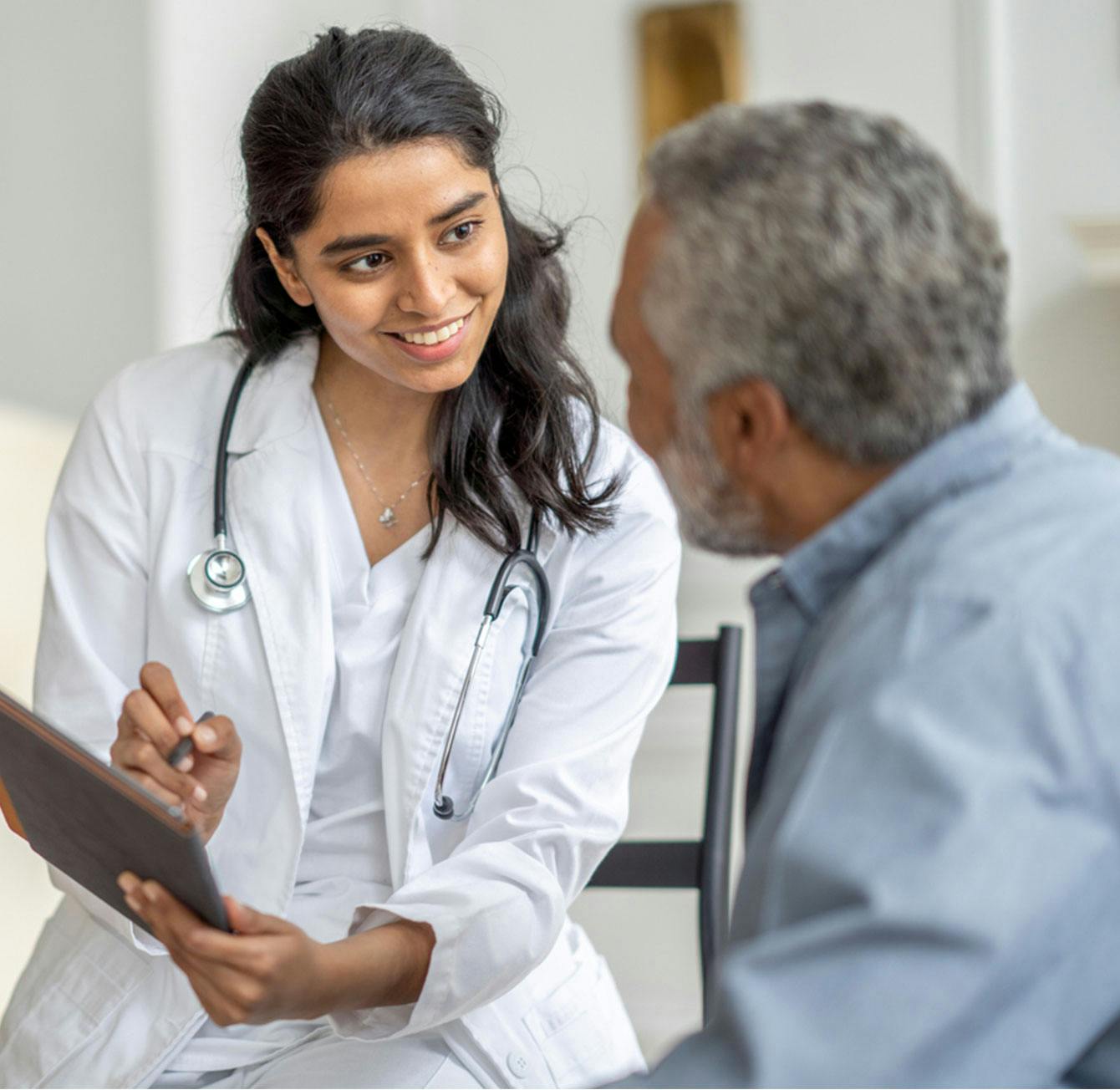 Doctor checking on a patient