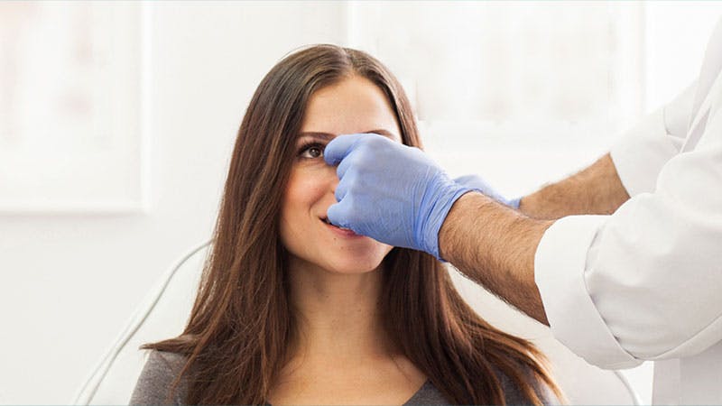 Doctor checking on a patient