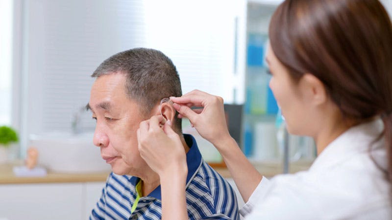 Doctor checking on a patient