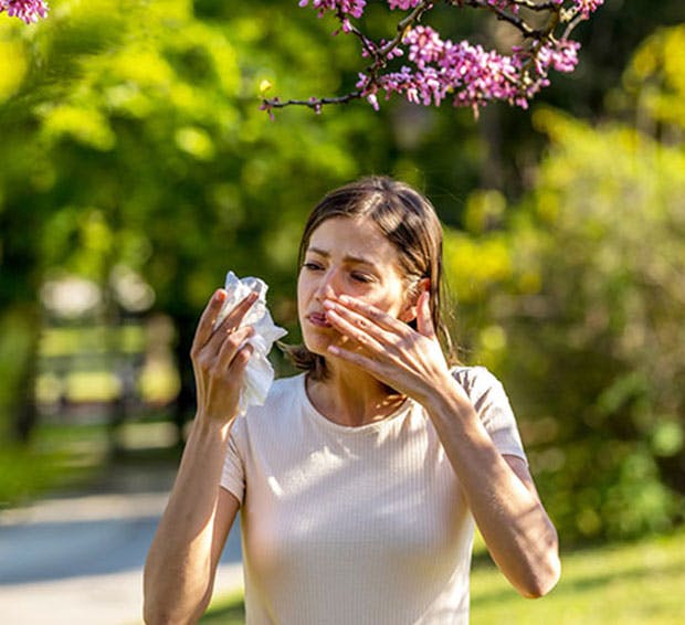 Woman dealing with environmental allergies