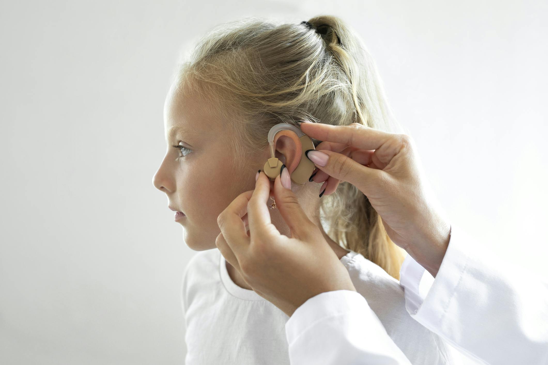 child getting fitted for a cochlear implant