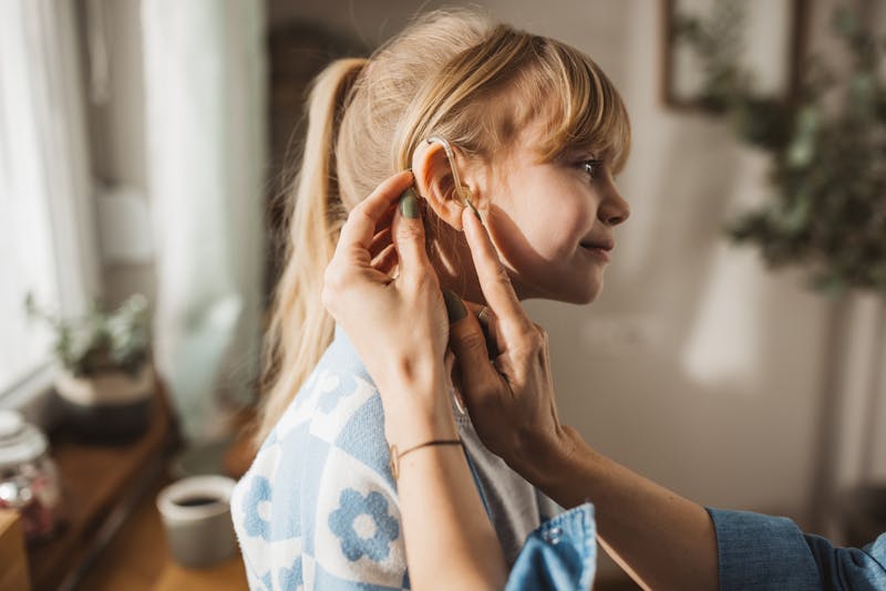 little girl with hearing aids