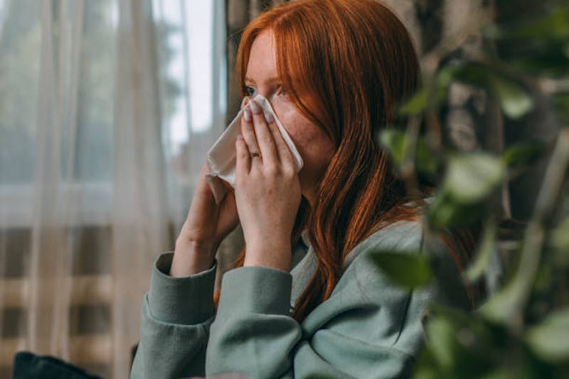 Woman Blowing Her Nose