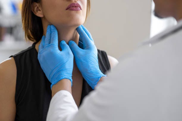 Woman Getting Her Thyroid Checked